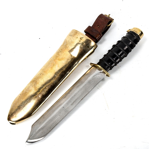 1034 - A Russian Navy diver's knife, with steel blade, rubber handle and brass fittings, original heavy sol... 