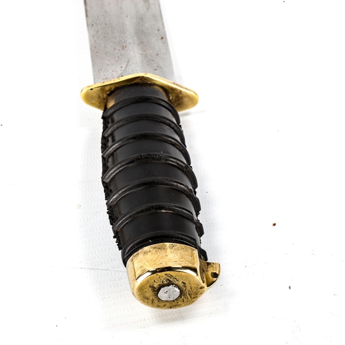 1034 - A Russian Navy diver's knife, with steel blade, rubber handle and brass fittings, original heavy sol... 