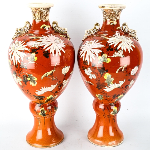 1040 - A pair of Japanese Satsuma pottery vases, circa 1900, with painted floral designs, height 40cm