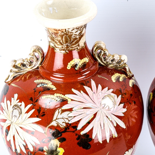 1040 - A pair of Japanese Satsuma pottery vases, circa 1900, with painted floral designs, height 40cm