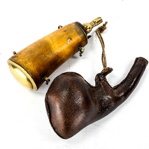 1070 - An Antique buffalo horn powder flask with brass mounts, length 18cm, and a pressed stitched leather ... 