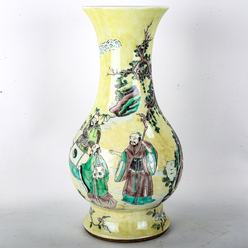 1074 - A Chinese yellow glaze porcelain vase, with painted figures and trees, 6 character mark, height 32cm