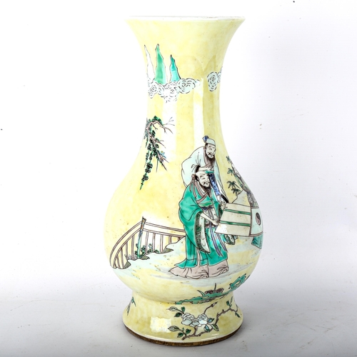 1074 - A Chinese yellow glaze porcelain vase, with painted figures and trees, 6 character mark, height 32cm