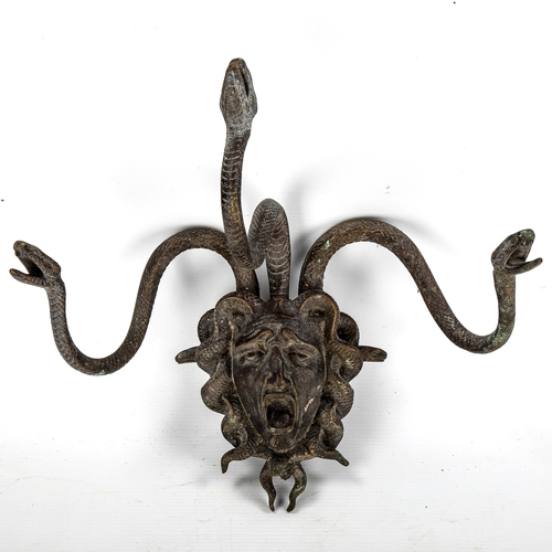 1077 - A patinated bronze wall-hanging coat rack in the form of Medusa, overall height 29cm