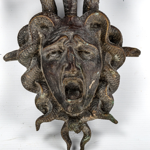 1077 - A patinated bronze wall-hanging coat rack in the form of Medusa, overall height 29cm