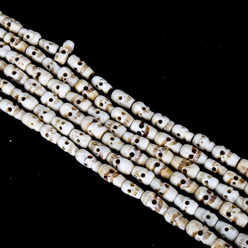 1079 - Tibetan yak bone skull design prayer beads, length approx 180cm