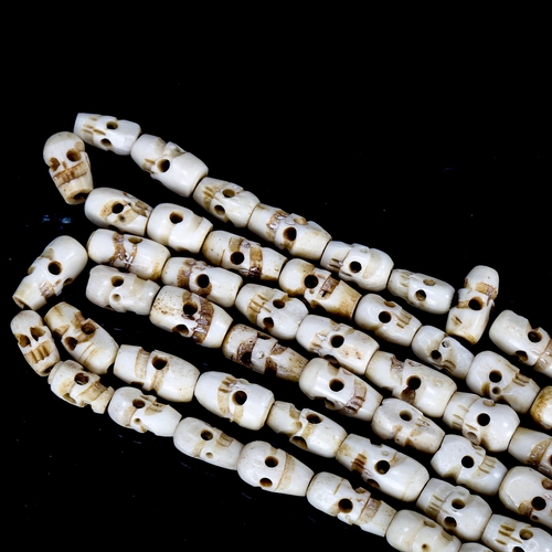 1079 - Tibetan yak bone skull design prayer beads, length approx 180cm