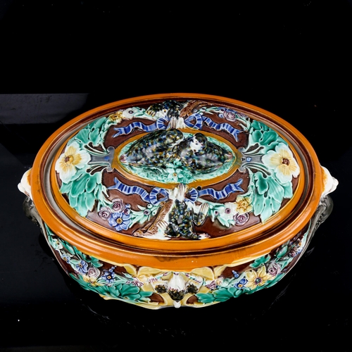 1080 - A Wedgwood Majolica game tureen and cover, with relief moulded game birds and flowers, impressed mar... 