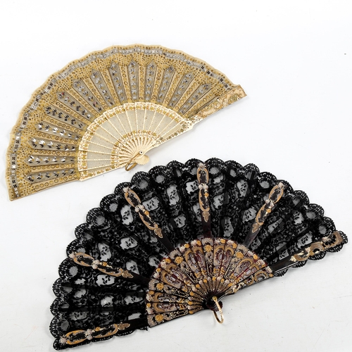 1082 - A 19th century French bone and lace fan, with gilded and pierced sticks, length 21cm, and a simulate... 