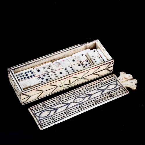 1083 - A Napoleonic Prisoner of War ox-bone games box, with cribbage marker lid enclosing original set of d... 