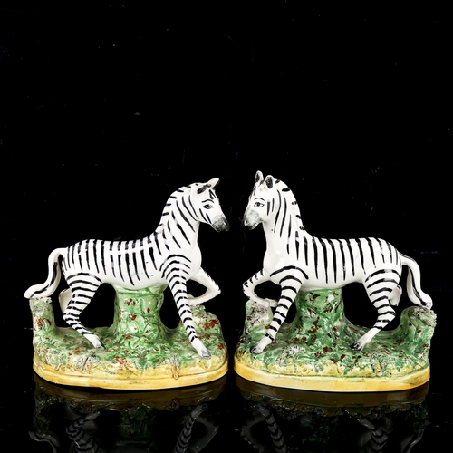 1085 - A pair of Staffordshire pottery zebra, height 12cm