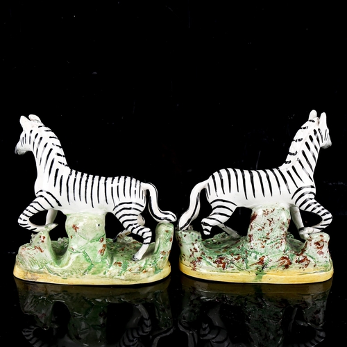 1085 - A pair of Staffordshire pottery zebra, height 12cm