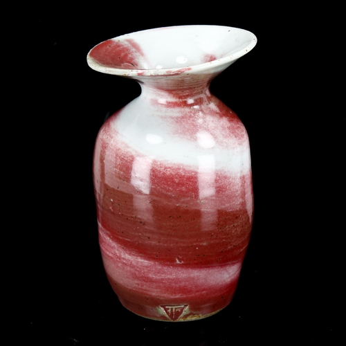 1089 - Marianne de Trey, Studio pottery vase with red marble glaze, height 10cm, rim diameter 6.5cm