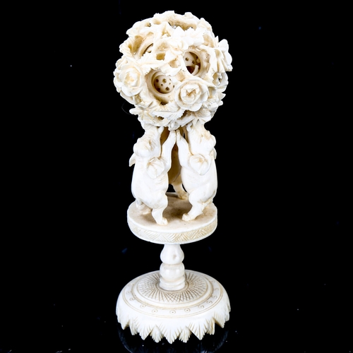 1092 - A Chinese ivory puzzle ball on elephant design stand, late 19th century, height 13cm