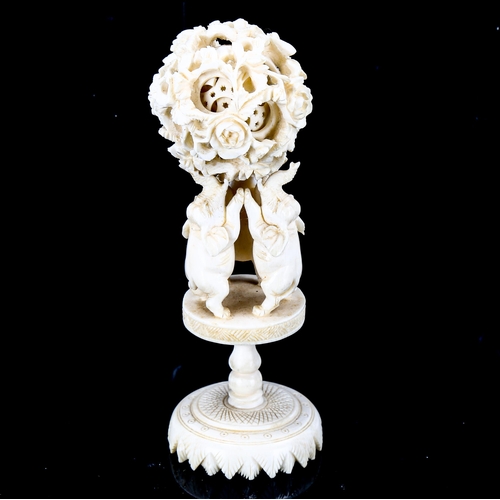 1092 - A Chinese ivory puzzle ball on elephant design stand, late 19th century, height 13cm