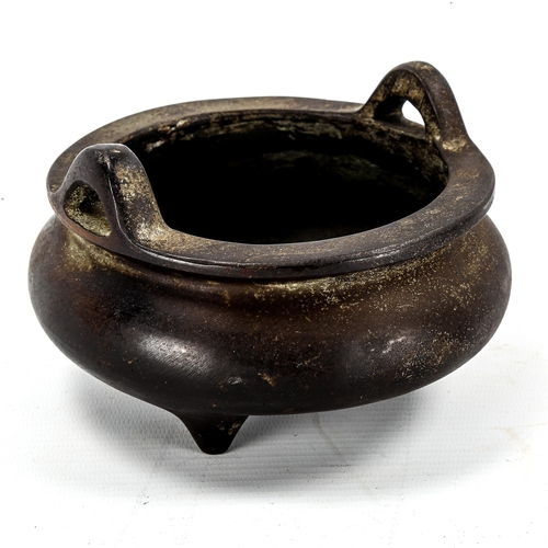 1097 - A Chinese patinated bronze incense burner, impressed seal mark under base, diameter 14cm