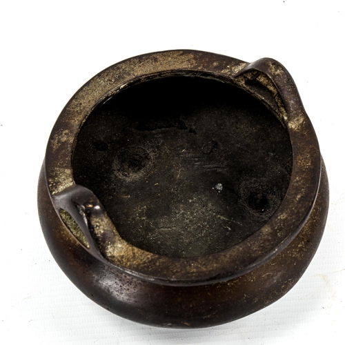 1097 - A Chinese patinated bronze incense burner, impressed seal mark under base, diameter 14cm