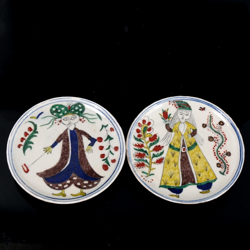 1124 - A pair of Turkish Kutahya pottery plates painted with figures, diameter 14cm