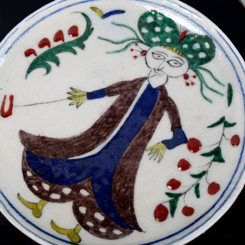 1124 - A pair of Turkish Kutahya pottery plates painted with figures, diameter 14cm