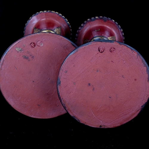 1127 - A pair of Turkish Tophane red and gilt pottery candlesticks, height 18cm