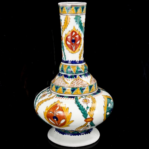 1128 - Turkish Kutahya pottery water jug with painted decoration, height 25cm