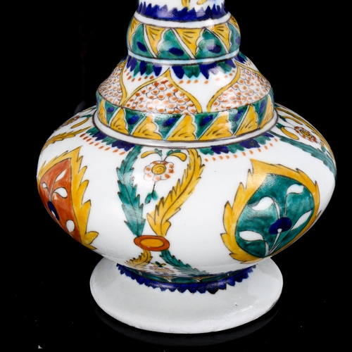 1128 - Turkish Kutahya pottery water jug with painted decoration, height 25cm