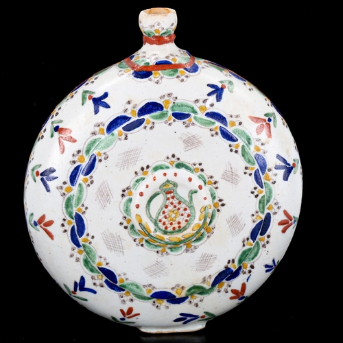 1129 - Turkish Kutahya pottery moon-shaped water flask, with painted decoration, height 20cm