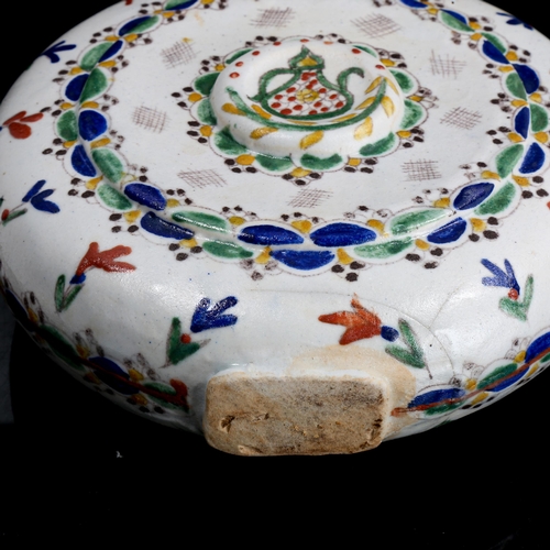 1129 - Turkish Kutahya pottery moon-shaped water flask, with painted decoration, height 20cm