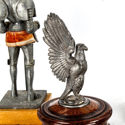 1132 - A pair of spelter knights in armour, height 21cm, a spelter eagle on oak plinth, and 2 other ornamen... 