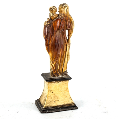 1146 - An Antique carved ivory figure of Mary with the Infant Christ, 18th or 19th century, on ivory plinth... 