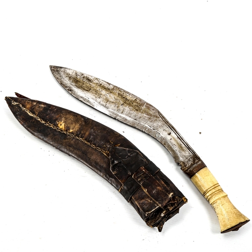 1147 - A Malayan kukri knife, early 20th century, with bone hilt and jewelled scabbard, length 42cm