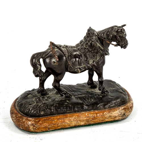 1148 - A small 19th century patinated bronze sculpture of a saddled horse, unsigned, length 11cm