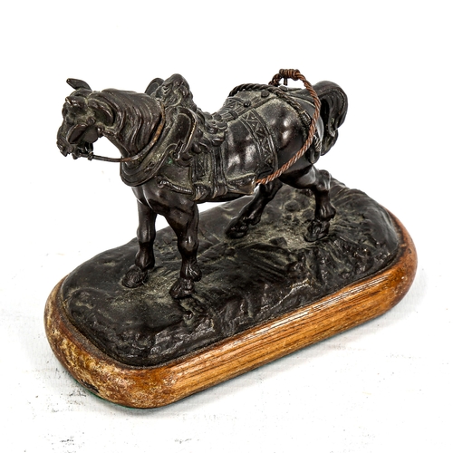 1148 - A small 19th century patinated bronze sculpture of a saddled horse, unsigned, length 11cm