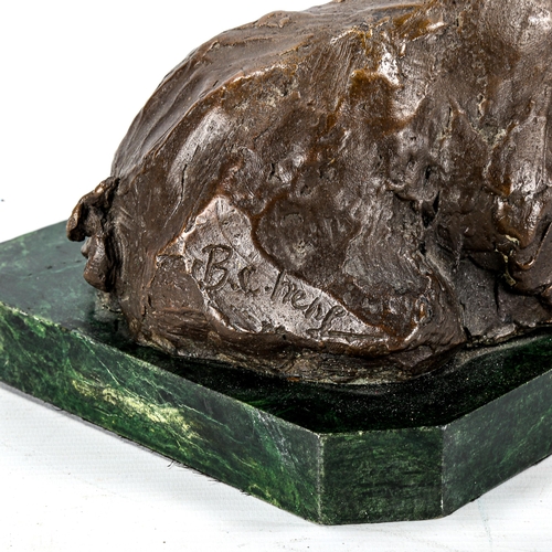 1160 - A patinated Studio bronze sculpture of a pig, indistinctly signed, on green marble base, length 34cm