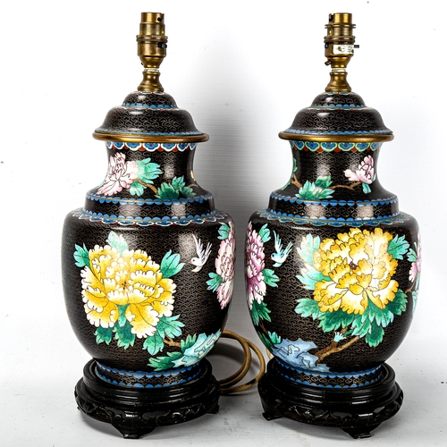 1175 - A pair of Chinese cloisonne enamel table lamps, on carved wood bases, height including fitting 42cm