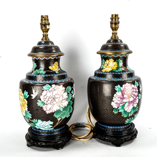 1175 - A pair of Chinese cloisonne enamel table lamps, on carved wood bases, height including fitting 42cm