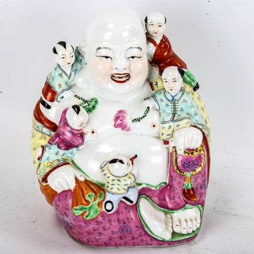 1177 - A Chinese porcelain seated Buddha with children, impressed marks under base, height 25cm