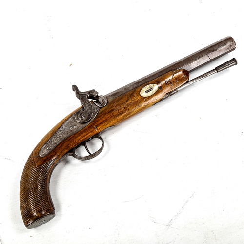 1179 - A 19th century percussion pistol, with engraved lock and carved walnut stock, length 36cm