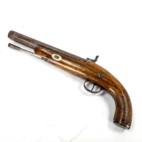 1179 - A 19th century percussion pistol, with engraved lock and carved walnut stock, length 36cm