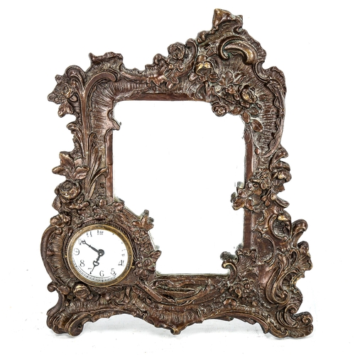 1191 - A relief cast patinated bronze strut mirror, with integral clock, height 23cm