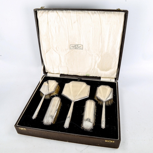 1193 - An Art Deco 5-piece silver-backed brush and mirror set, boxed