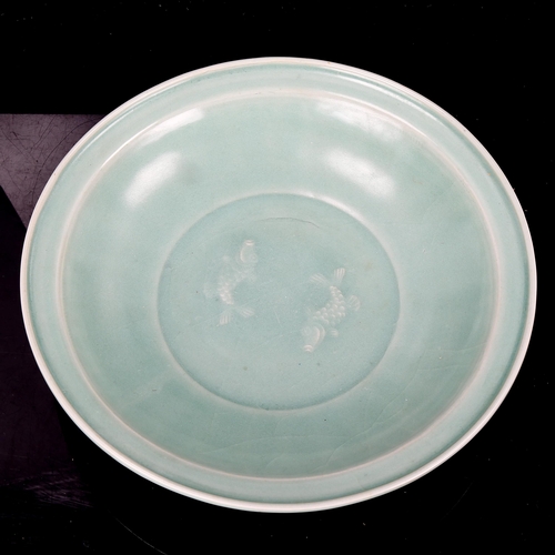 1200 - A Chinese celadon glaze porcelain bowl, with moulded fish design, diameter 25cm