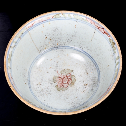 1201 - A Chinese porcelain bowl with painted floral decoration, diameter 15cm (A/F)