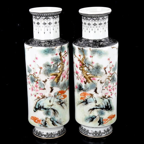 1203 - A pair of Chinese white glaze porcelain sleeve vases, with painted exotic birds and text, seal marks... 