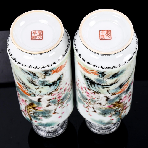 1203 - A pair of Chinese white glaze porcelain sleeve vases, with painted exotic birds and text, seal marks... 