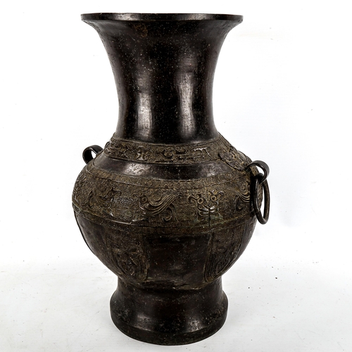 1206 - A large Chinese patinated bronze vase, with relief moulded friezes, height 46cm, rim diameter 22cm