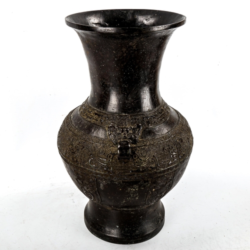 1206 - A large Chinese patinated bronze vase, with relief moulded friezes, height 46cm, rim diameter 22cm