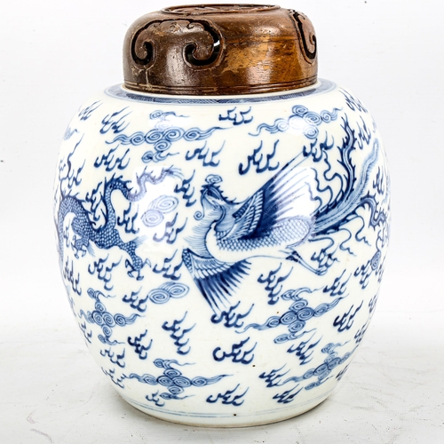 1246 - A Chinese blue and white porcelain dragon jar, with hardwood cover, height 24cm