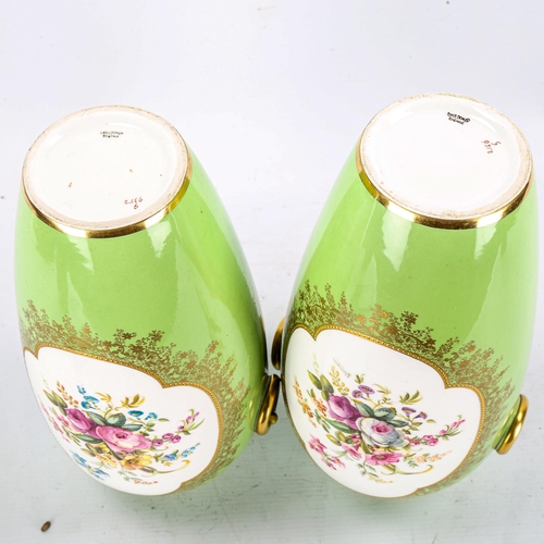 1247 - A pair of Cauldon green ground porcelain vases with hand painted botanical panels, signed B Harrison... 