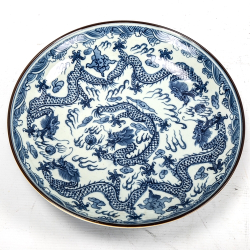 1252 - A Chinese blue and white porcelain dragon bowl, 6 character mark, diameter 28cm